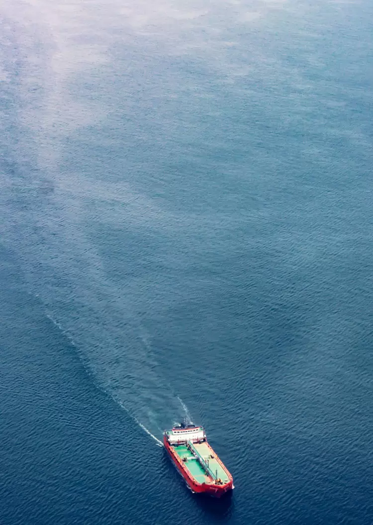 Cargo vessel at sea representing cloud and digital transformation for logistics